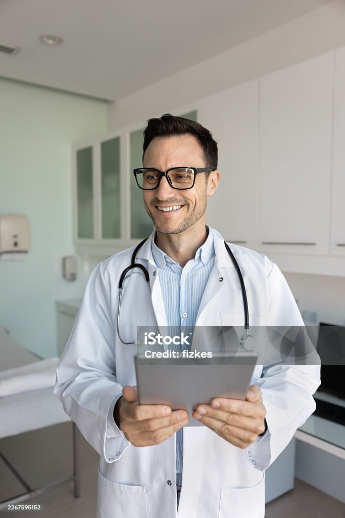 Doctor Holding Tablet